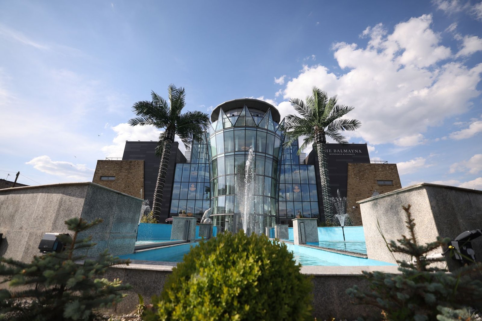 The Balmayna building and fountains by day