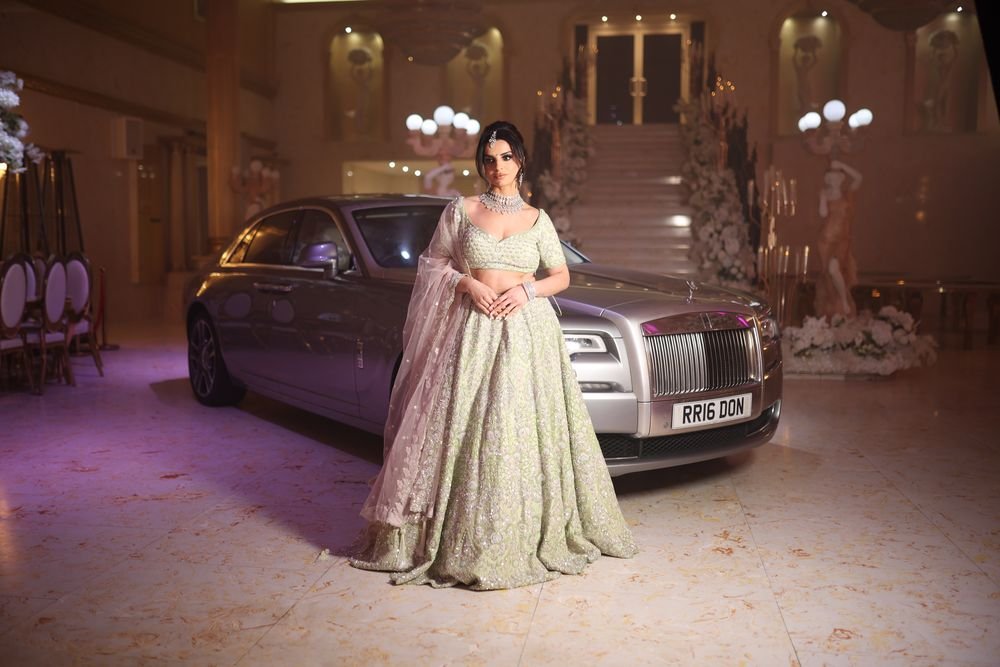Bride beside a Rolls-Royce at The Excellency