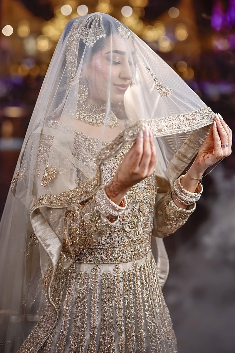 Bride lifting her veil