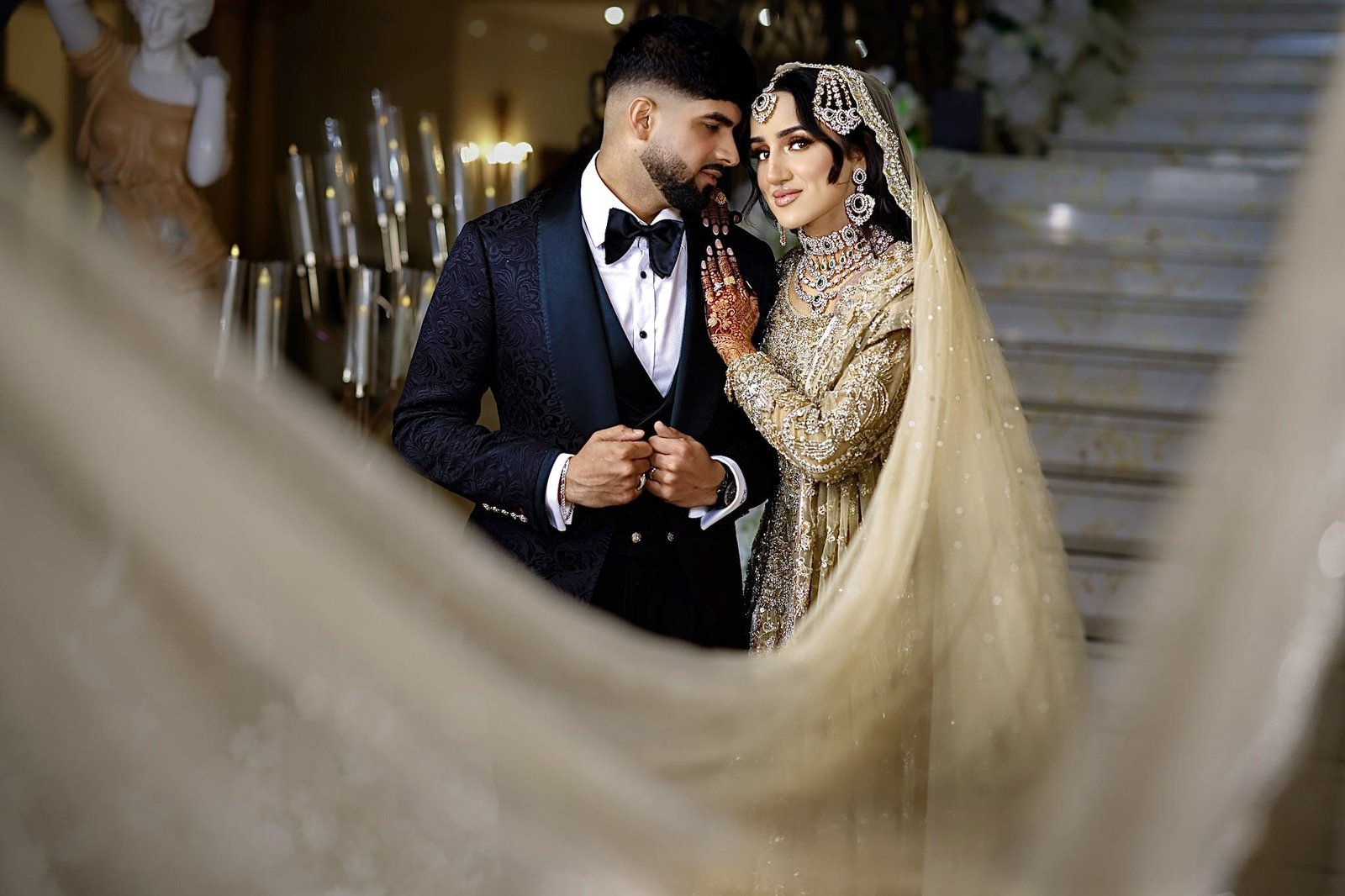Bride and groom with her veil flowing