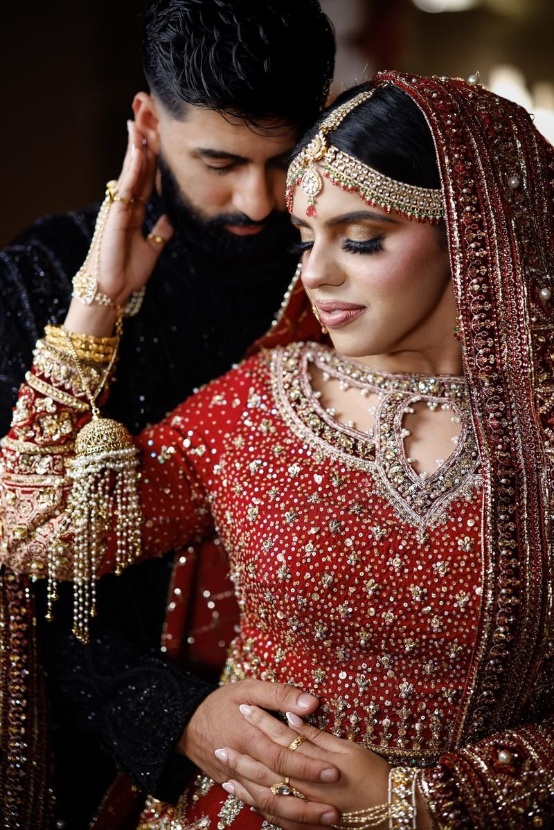 Groom and bride in red and gold