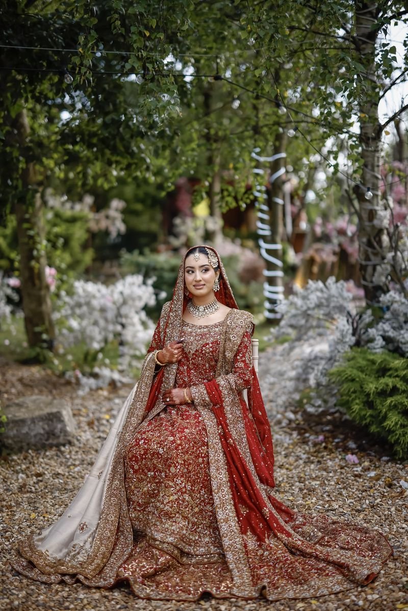 Bride seated in a garden