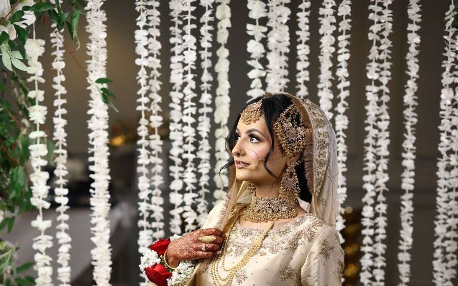 Bride seated among floral strands